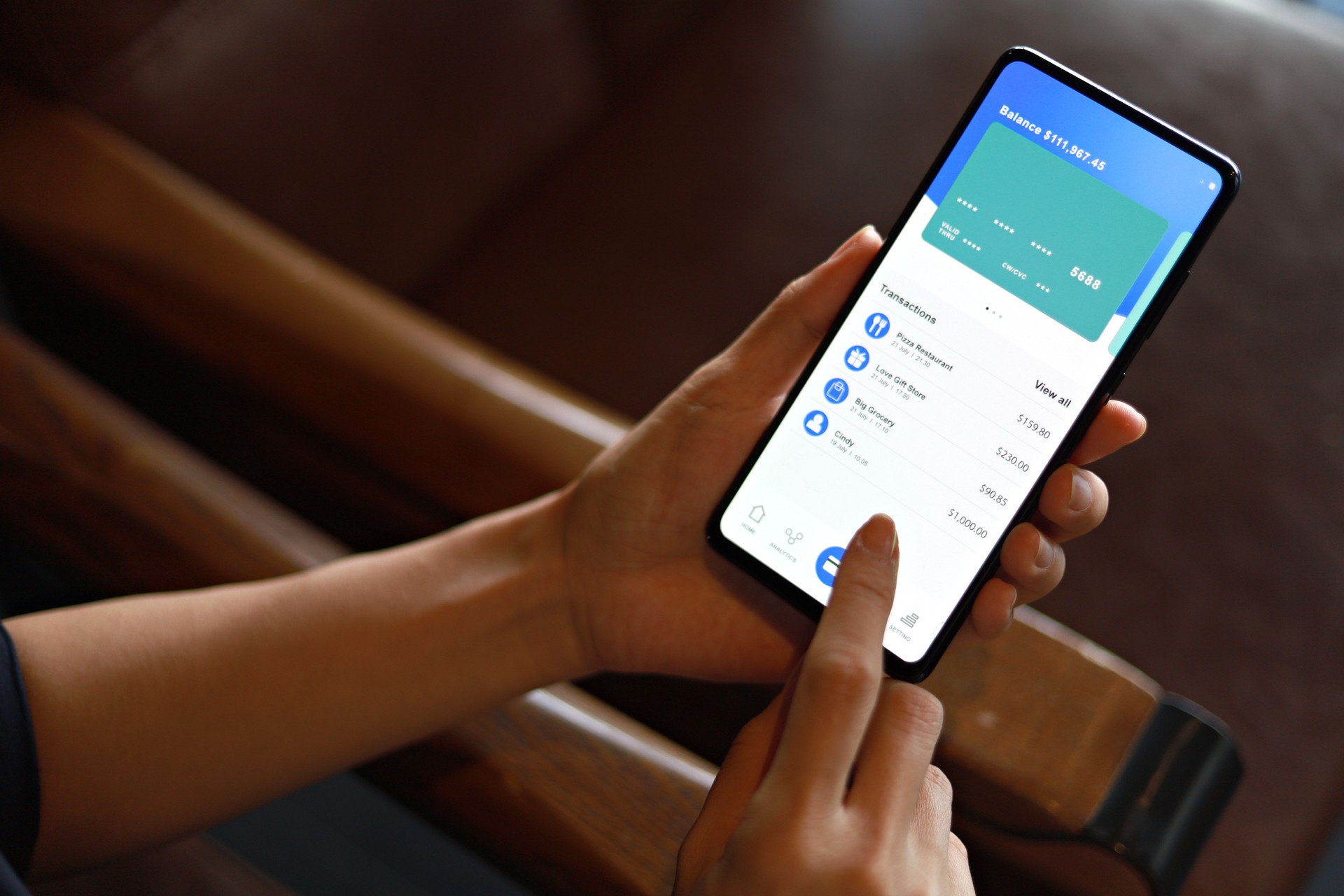 Woman managing banking and finance with online banking mobile app on smartphone