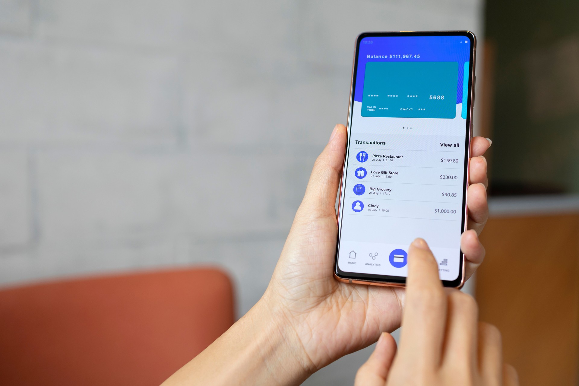 Person managing banking and finance with online banking mobile app on smartphone